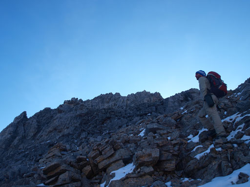 Liam scrambling up Pika Peak