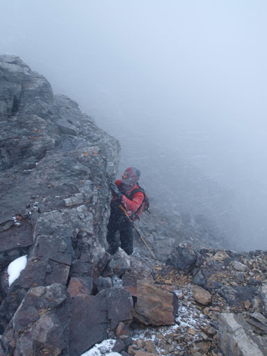 Laurens coming up the scrambling move on the descent. Typical weather too...