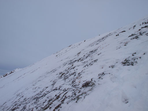 Descending snow covered slabs (not scree) near the summit was pretty difficult