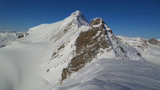 Big terrain ahead. Looking towards the summit from top of this downclimb
