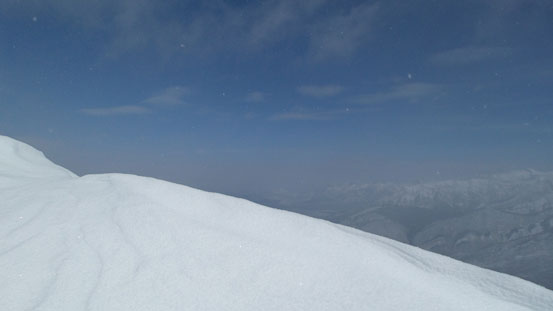 Snow, clouds, and blue sky.