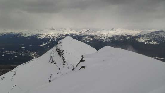 The next summit is lower and getting their requires difficult down-climb.