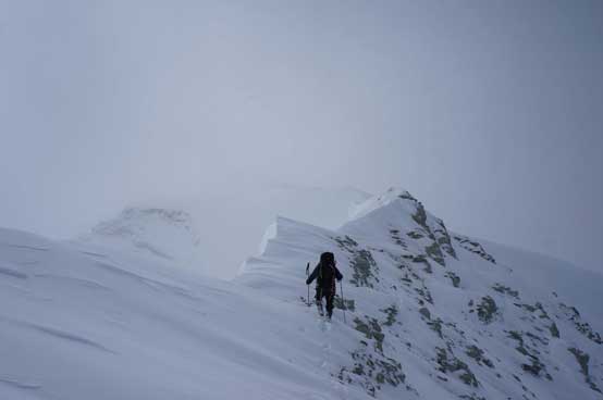 Me ascending the challenging terrain on the connecting ridge. Photo by Ferenc Jacso