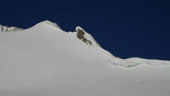 Ahead is the rock outcrop we had to bypass on this (south) side. So no matter what line we picked we still had to climb the steep slope.