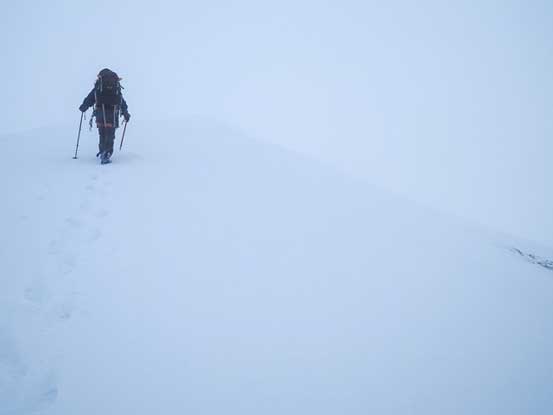 Me approaching the summit in a white out. Photo by Vern