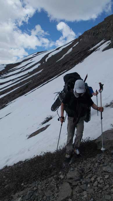 Ben with a steep snow slope behind