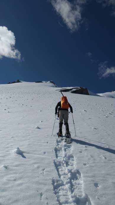 Ben leading the way, snowshoeing straight up the slope