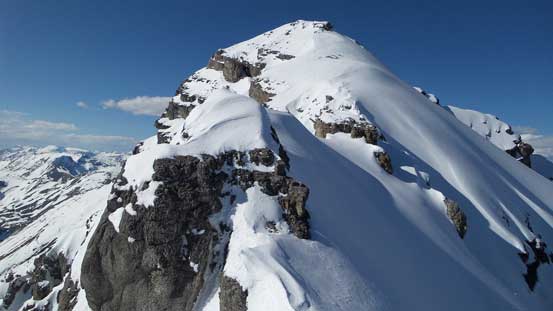The complex summit ridge. Ahead is the first rock step crux