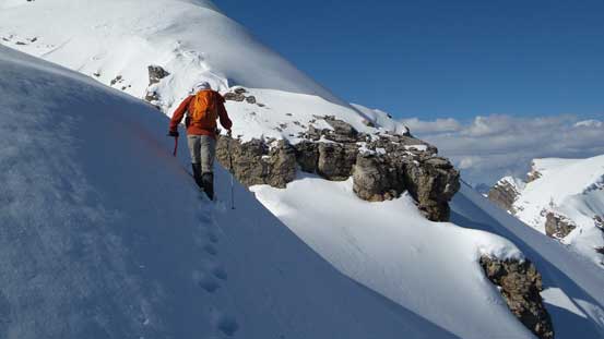 Traversing steep snow to avoid cornices that we couldn't tell the boundary