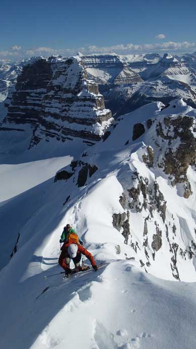 Ben climbing up steep terrain just above the second rock step