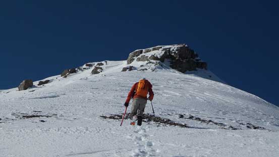 Ben ascending easy terrain towards the summit block