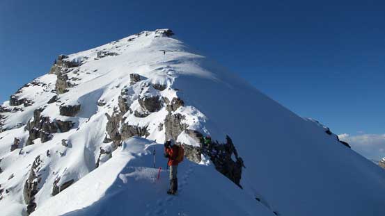 Vern down-climbing the second step. Eric descending the upper slope in the background