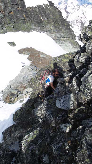 Ben scrambling up the lower rock section
