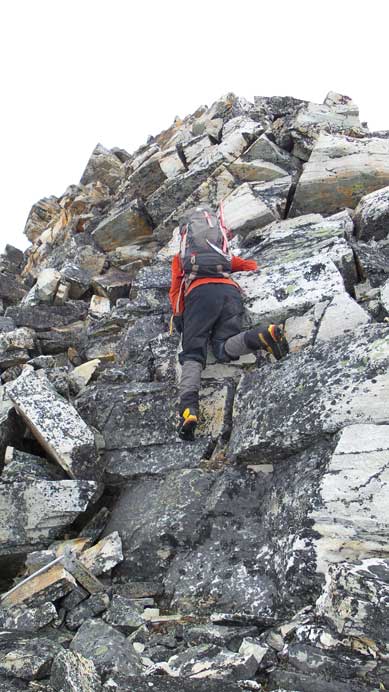 Ben down-climbing from the summit