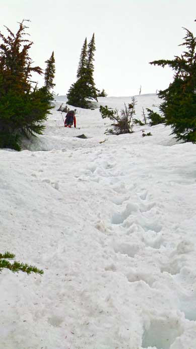 Down-climbing steep terrain into Grizzly Bowl