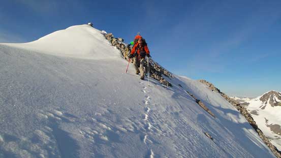 Ben descending back down the snow near the summit
