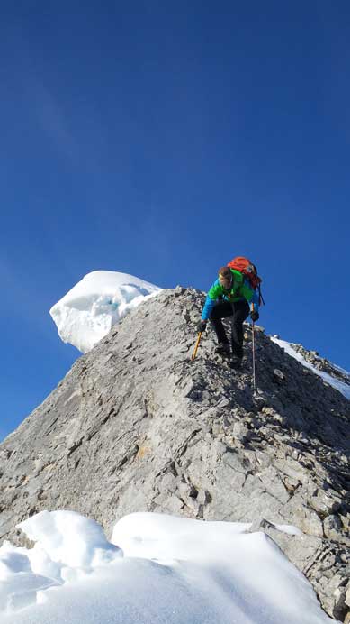 Vern carefully descending the summit ridge