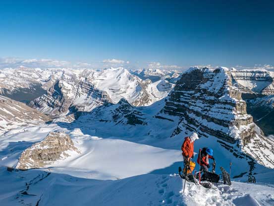 Me and Ben packing our snowshoes in the backpack. Ready to drop down. Photo by Vern