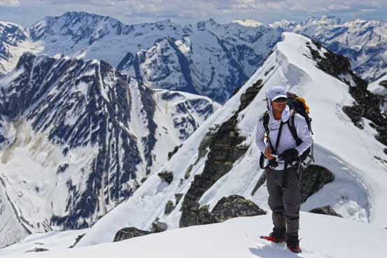 Me with the false summit behind. Photo by Ben