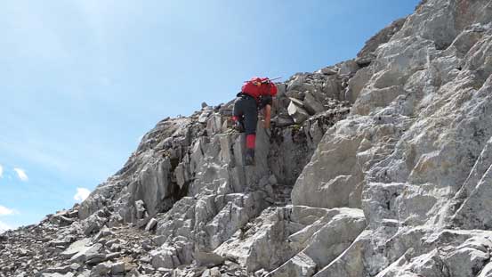 Brandon down-climbing a difficult step from the summit