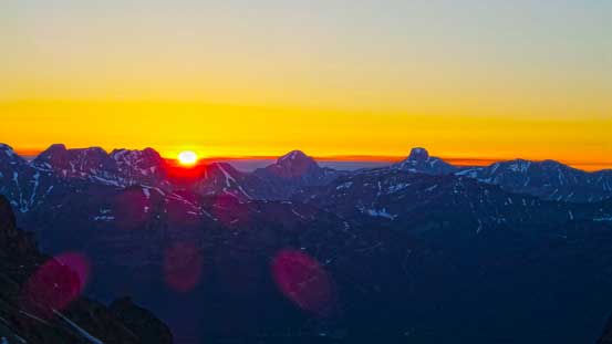 Sunrise over the horizon. The two big peaks on the skyline are Mt. Douglas and Mt. St. Bride