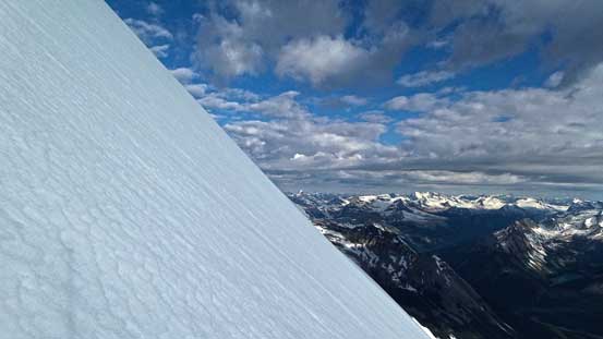 Down climbing the upper north face. It's hard to tell the slope angle without a climber in the photo...