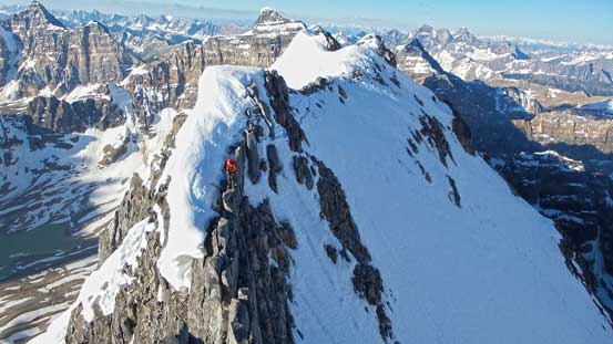 Ben crossing an exposed section with the ridge behind