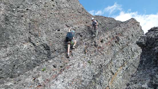 Ken and Ben down-climbing the ledge from Peak 5