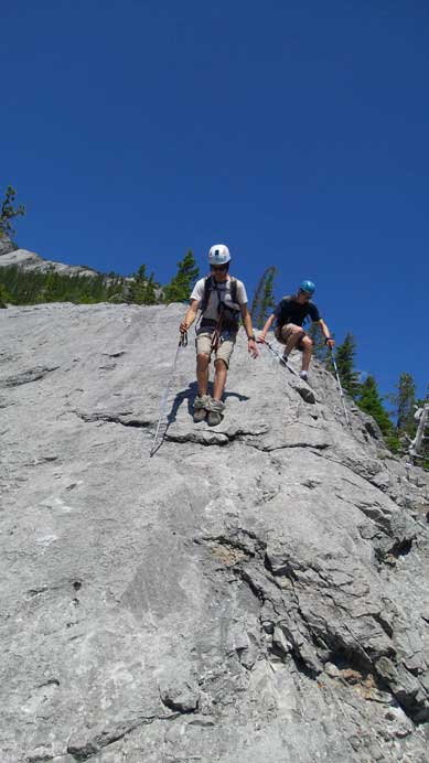 Ben and Ken hiking down some slabs