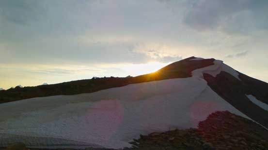 Sun setting behind the ascending ridge to Copperstain