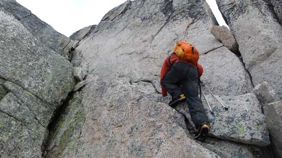 Ben climbing up the 3rd class (or 4th class) step just before the false summit