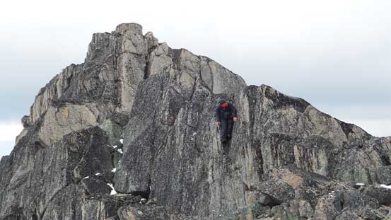 Ben descending a challenging step on the connecting ridge