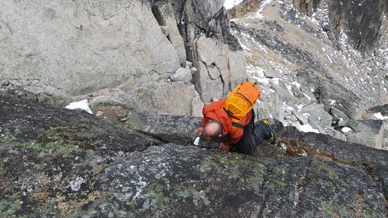 Ben down-climbing the 3rd/4th class step just below the false summit. It's quite wet actually