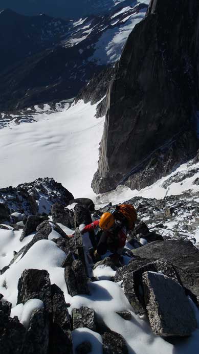 Ferenc dealing with fresh snow coated granite.