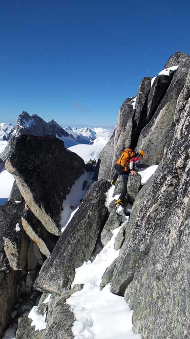 Ferenc had to traverse an exposed, down-sloping and snow coated ledge to the base of 5.4 chimney/crack.