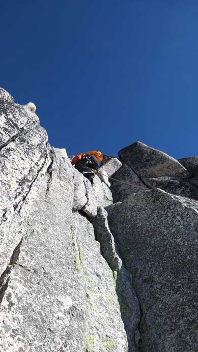 Ben leading up the first pitch of 5.4 climbing