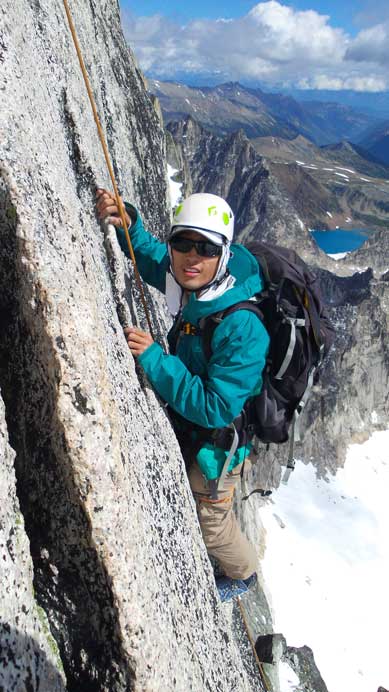 Me ascending the first few move on the gendarme, just before crossing over the edge. Photo by Charlie