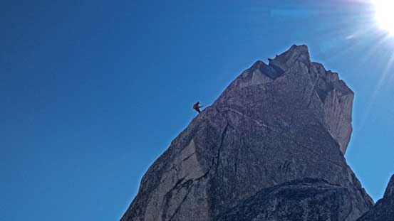 Ben starting the double-length rappel off the summit