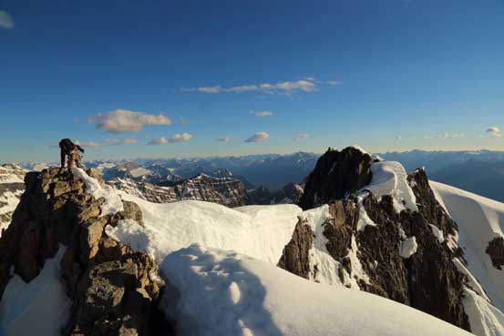 Me traversing towards the true summit. Photo by Ben N