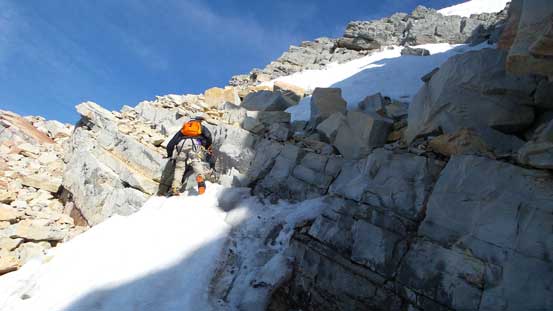 Ben negotiating a rock step in this couloir