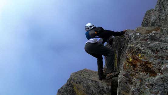 Kevin down-climbing the crux step