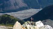 Ben ascending the ridge with the braided Robson River way down below
