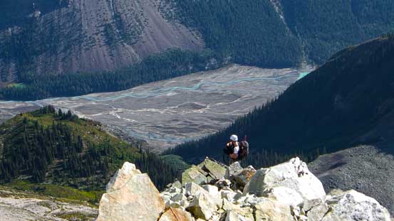 Ben ascending the ridge with the braided Robson River way down below