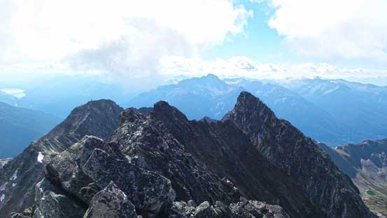 Looking back from the true summit. False summit is the lower bump on left