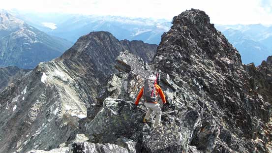 Ben traversing back the summit ridge