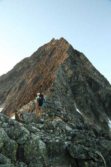 Me at the col with NW Ridge ahead. Looks very exciting. Photo by Ben