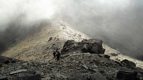 Hiking up the summit pyramid, we entered the clouds