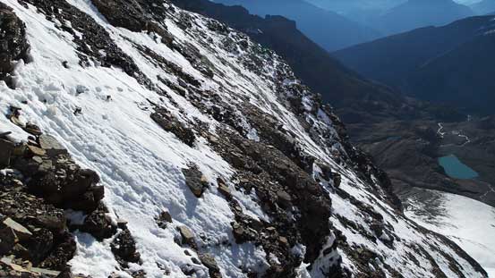 Looking back at the down-sloping snow covered terrain we just traversed/ascended.