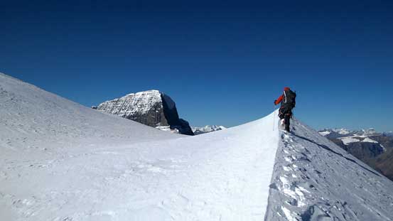 Ben leading up a mini snow arete. Alberta slowly showing up!