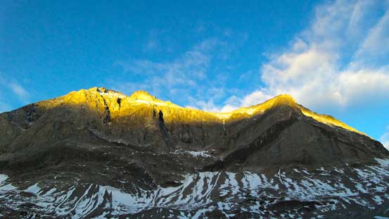 Cool morning colour shown on the impressive rock wall.